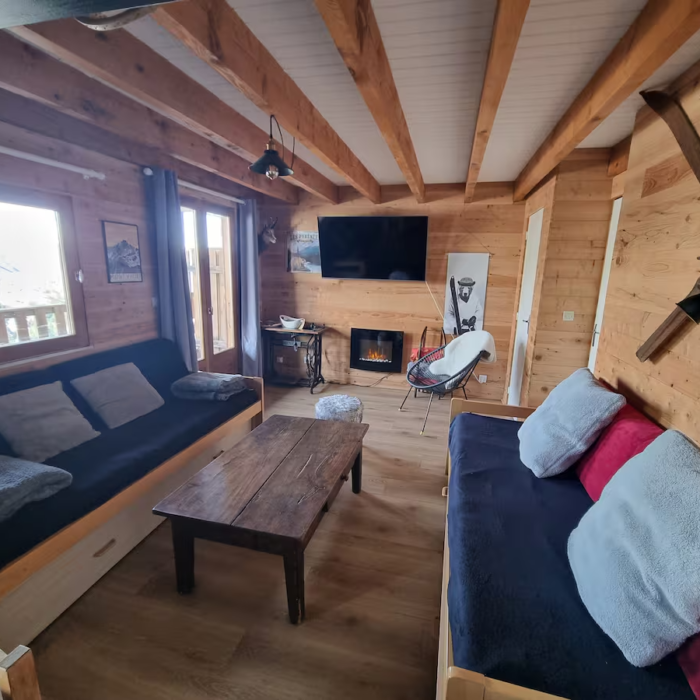 Salon d'un charmant chalet en location saisonnière à Guzet Neige